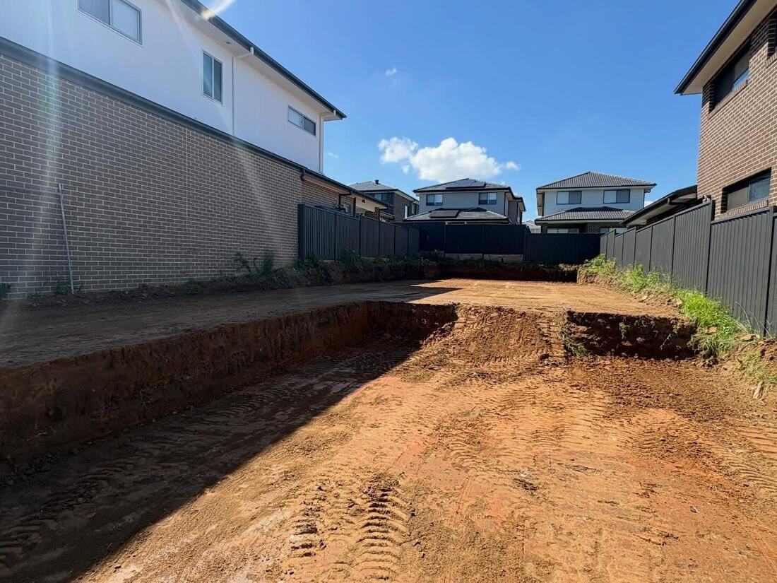 Tight access excavation between two established homes