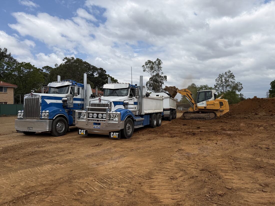 Prime Excavation trucks and excavator lined up on site